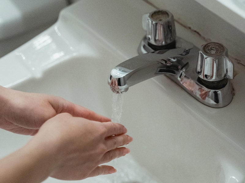 A Woman Washing her Hands